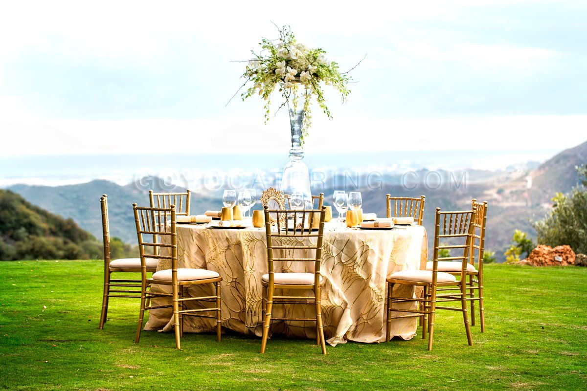 Beige printed tablecloth. | Goyo Catering