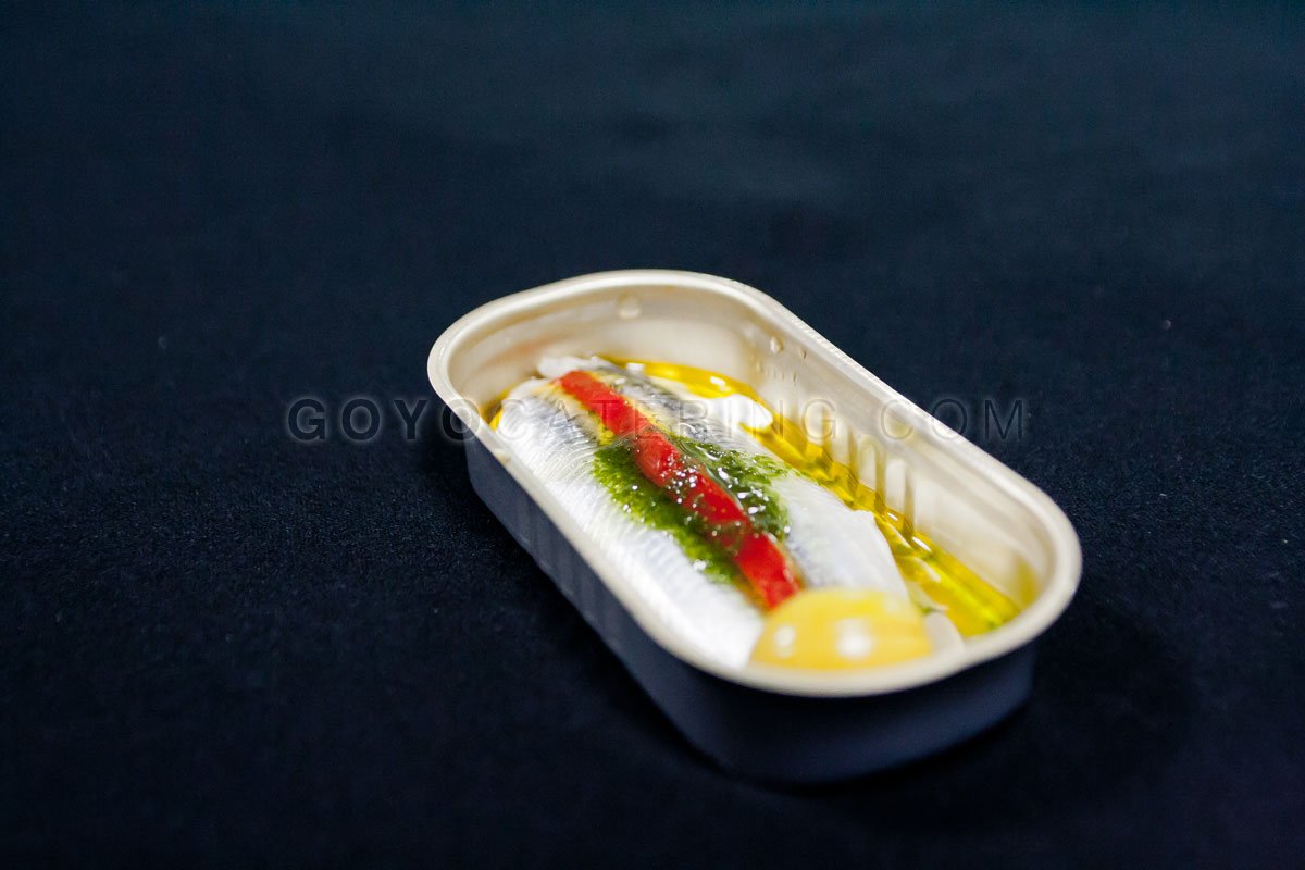 Anchovies of Malaga with vinegar and parsley oil.